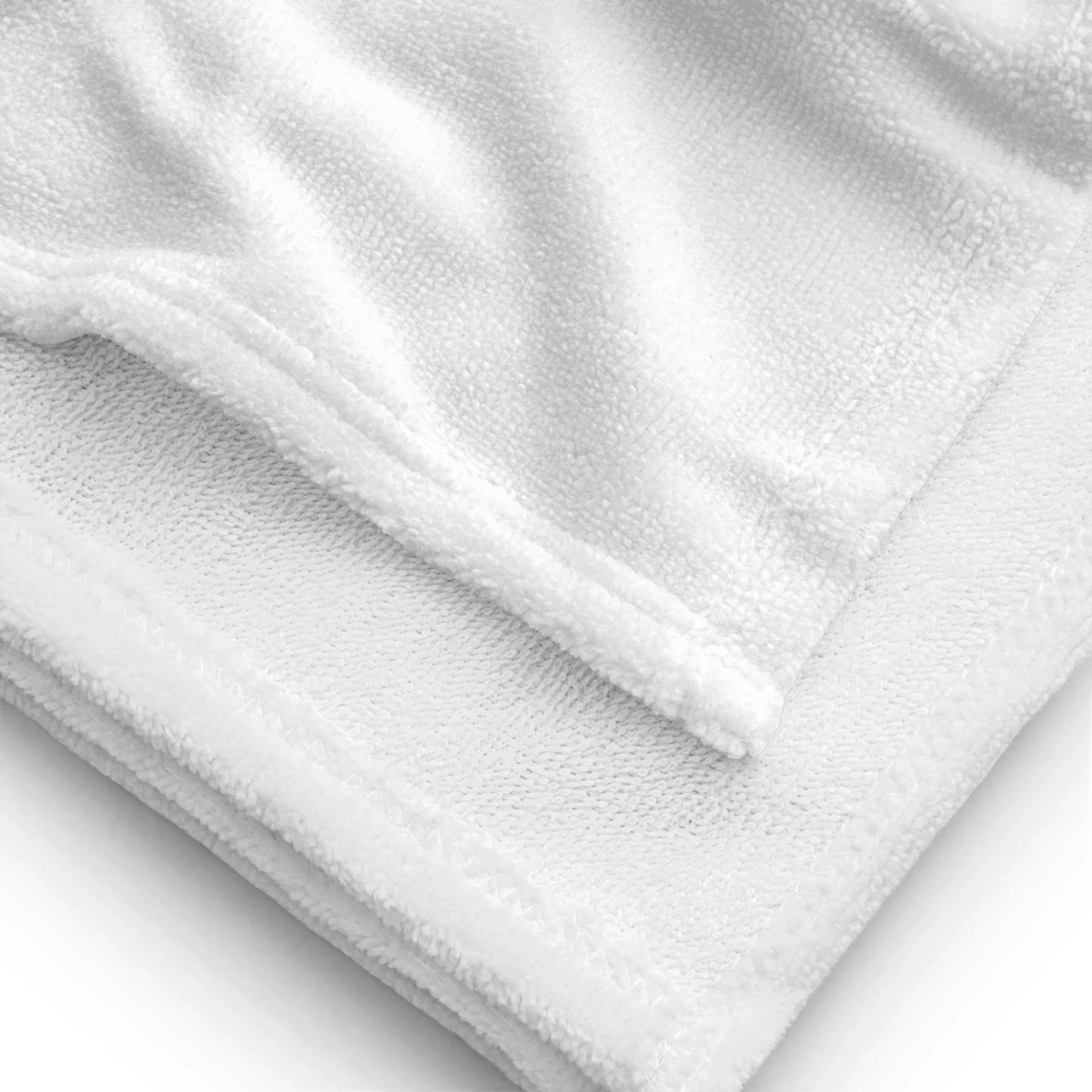 Lifestyle styling of personalized all-over beach towel — all-over print towel ready for daily use