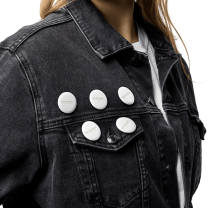 Lifestyle styling of personalized set of pin buttons — accessory ready for daily use