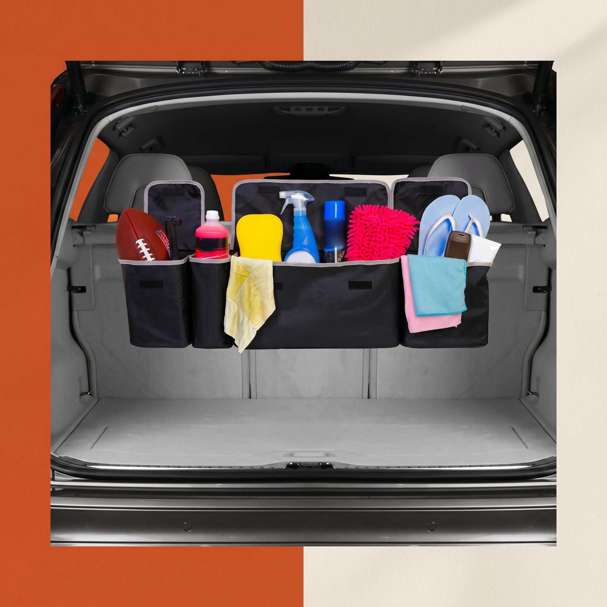 Car trunk with a black Shazory organizer containing various items on an orange and beige background
